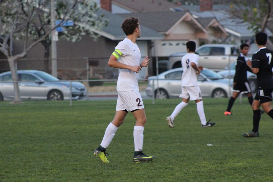  Senior Aaron Jankowski in action at his last high school soccer game.
