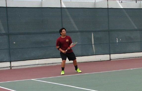 ​Senior Thomas Rhim plays Number Two Doubles in his match against against El Modena.
