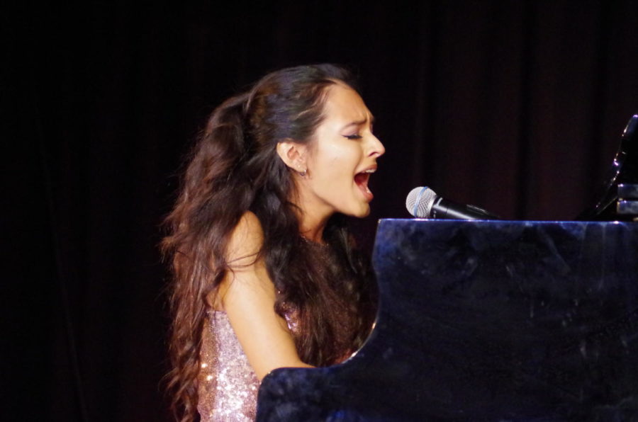 Paloma Cervantes (12) both plays the piano and sings Empire State of Mind.