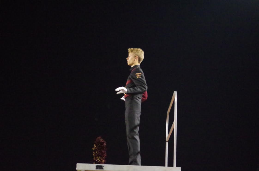 Drum Major Cole Wiseman as he begins conducting the performance.