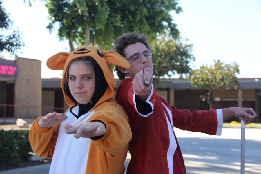 Freshman Autumn Blais, and sophomore Aidan Dobyns dressing up in their favorite halloween costumes.