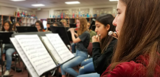 Megan Kamaly, junior and principal chair in Advanced Band, sight reads a possible new festival piece during first period.  First Period is preparing for upcoming SCSBOA festival on March 26.