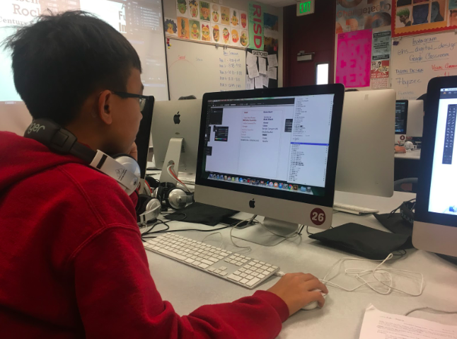 Freshman Ethan Vo on Adobe Illustrator trying out different fonts. 
