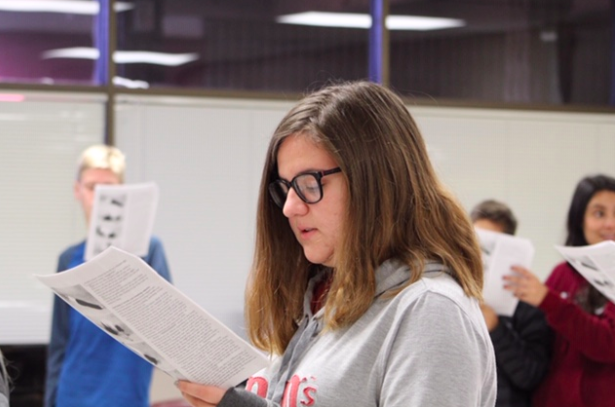 Freshman Kylie Tonetti delivers lines for a vocal warm up. The class is reading lines of tongue-twisters to help with enunciations.