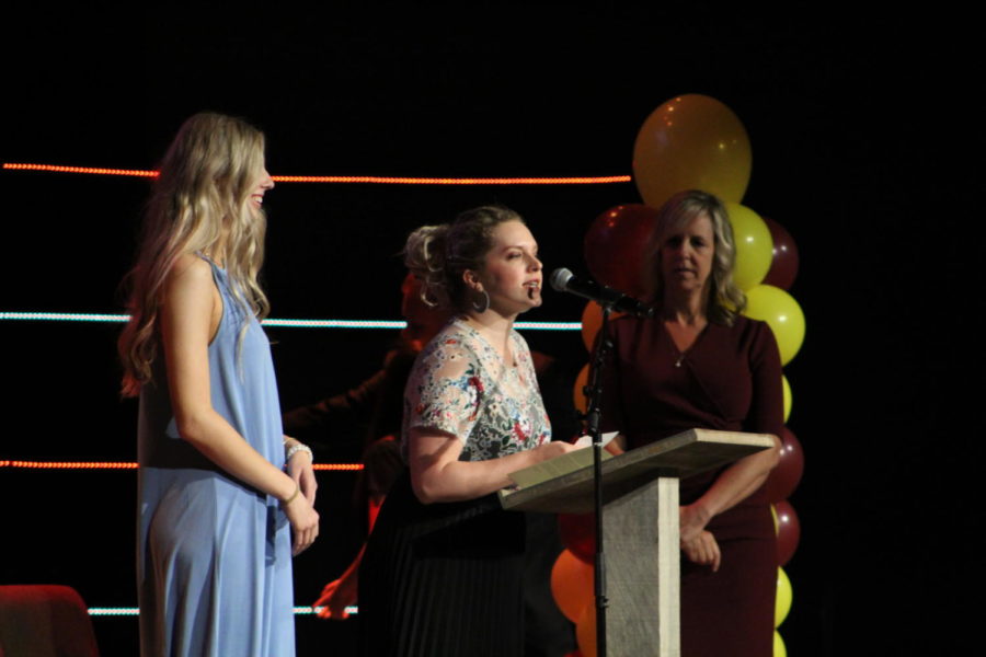 Junior Mackenzie Lemmon and Principal Gina Aguilar watch Whitney Leonard as Lemmons name is announced at the ceremony.