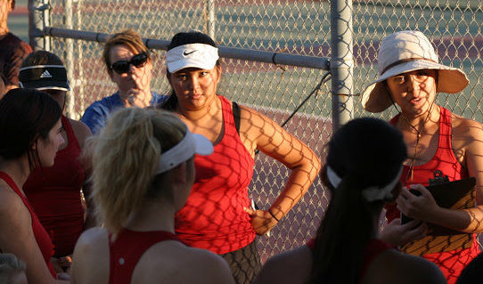 The tennis team coming together to win their last game on against Brea Olinda.